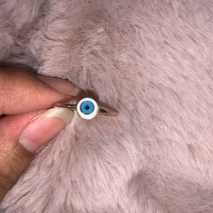 Accessorize evil eye ring.